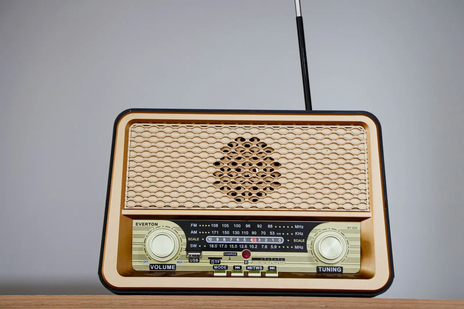 A small portable radio with its antenna raised