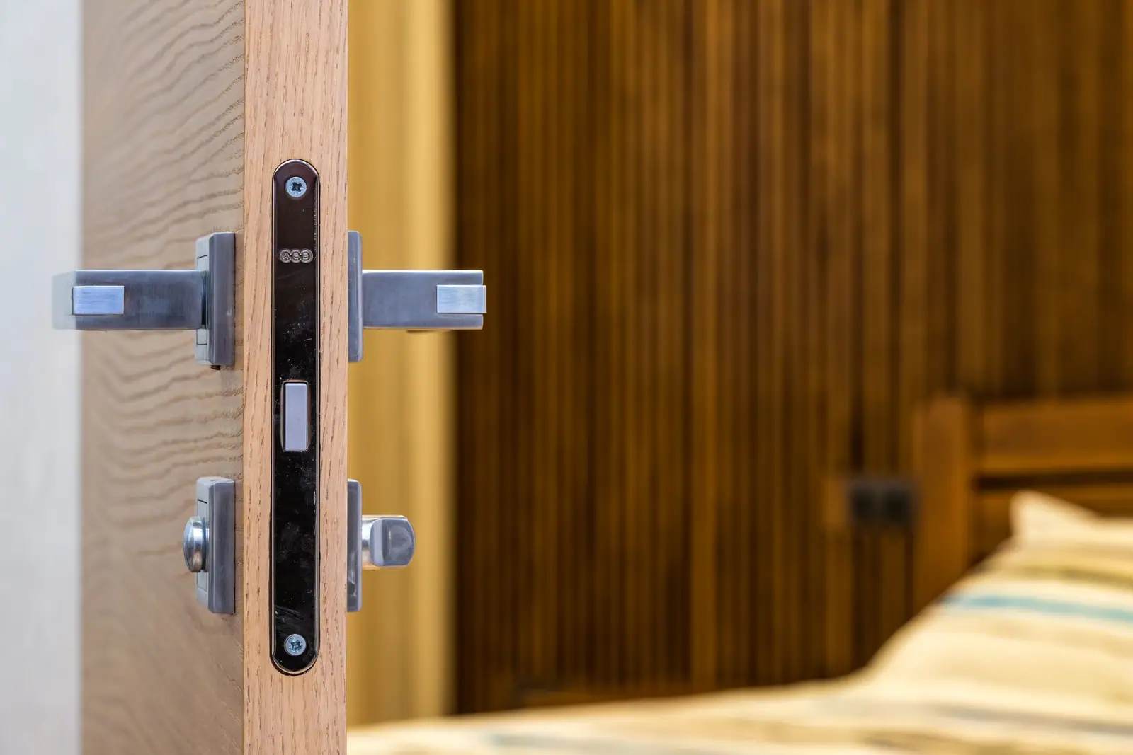 An open door showing the lock and handle on its edge