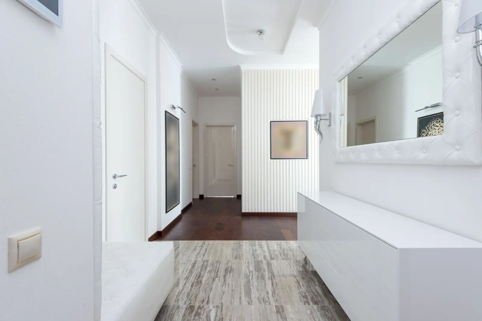 A bright hallway with several closed doors