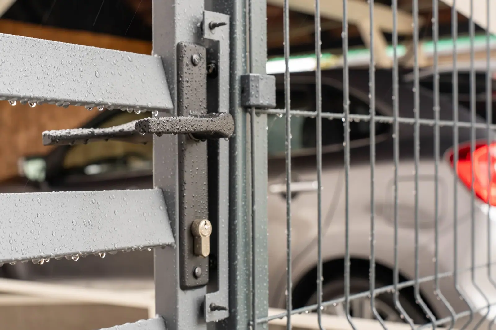 A close view of the latch on a metal gate