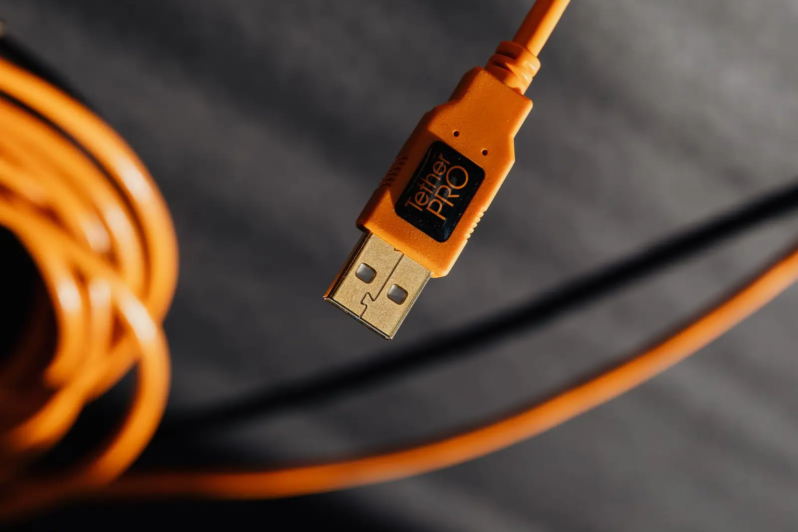 A coiled orange extension cable