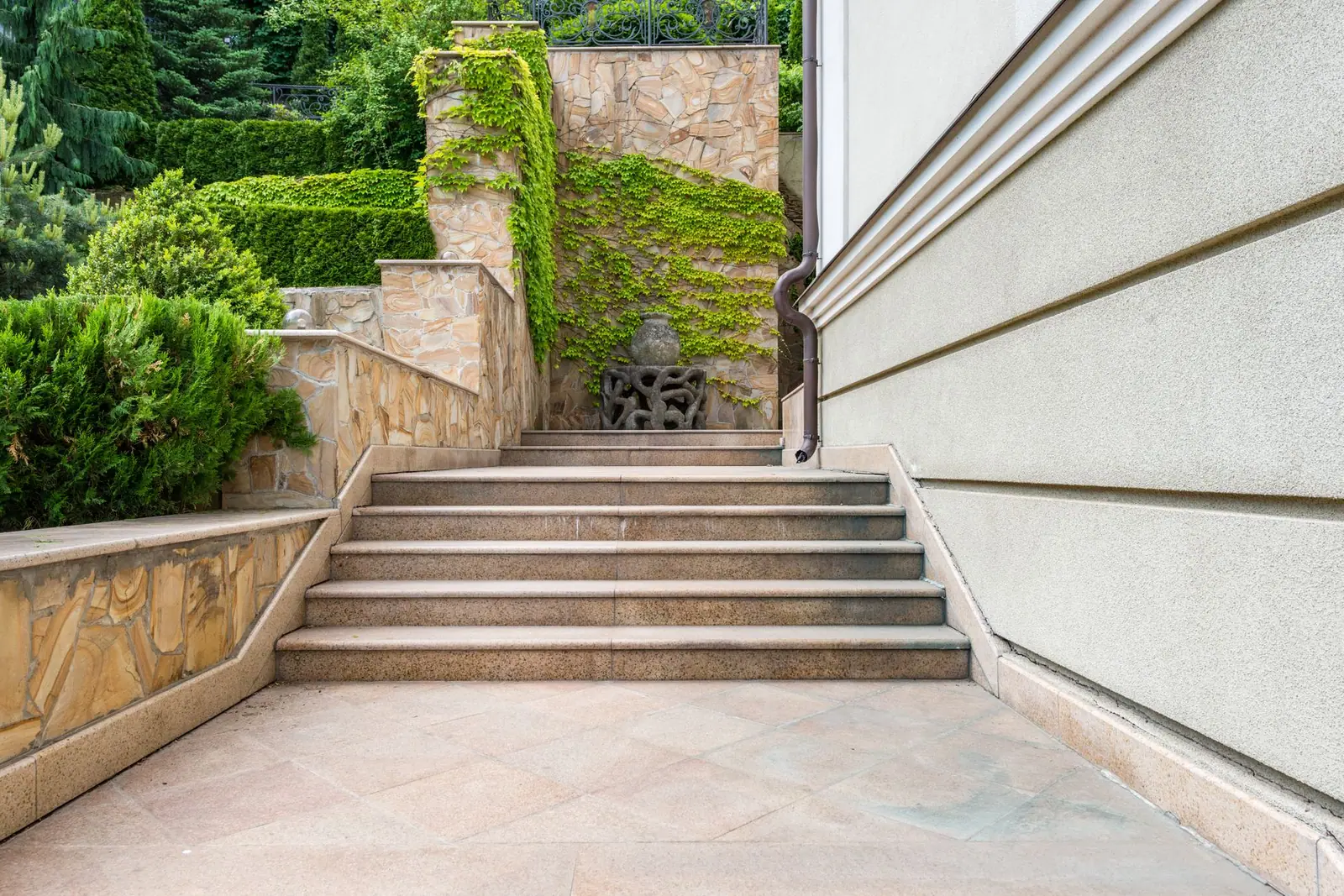 A ramp running alongside a flight of stone steps