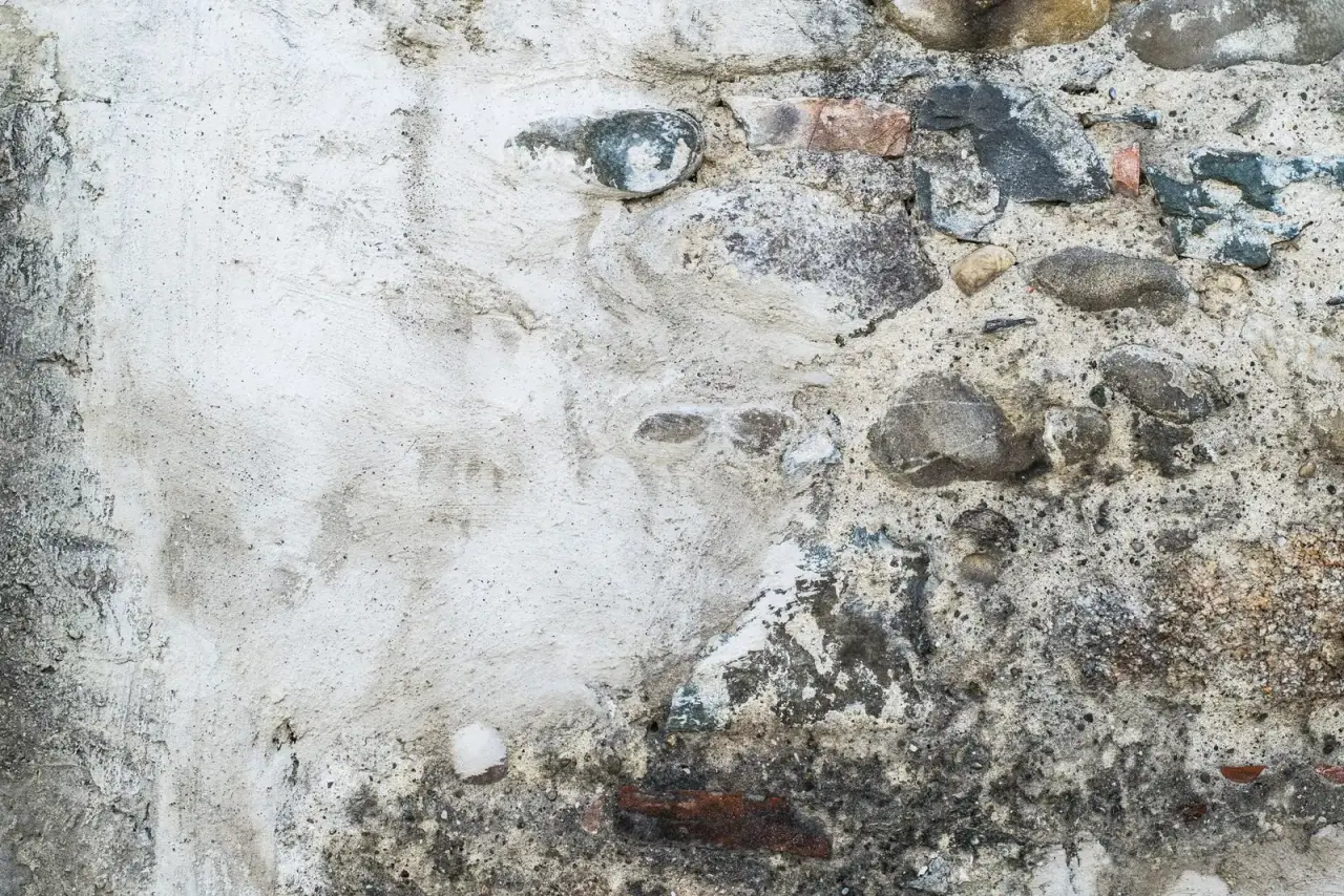 A rough wall of stones set in mortar